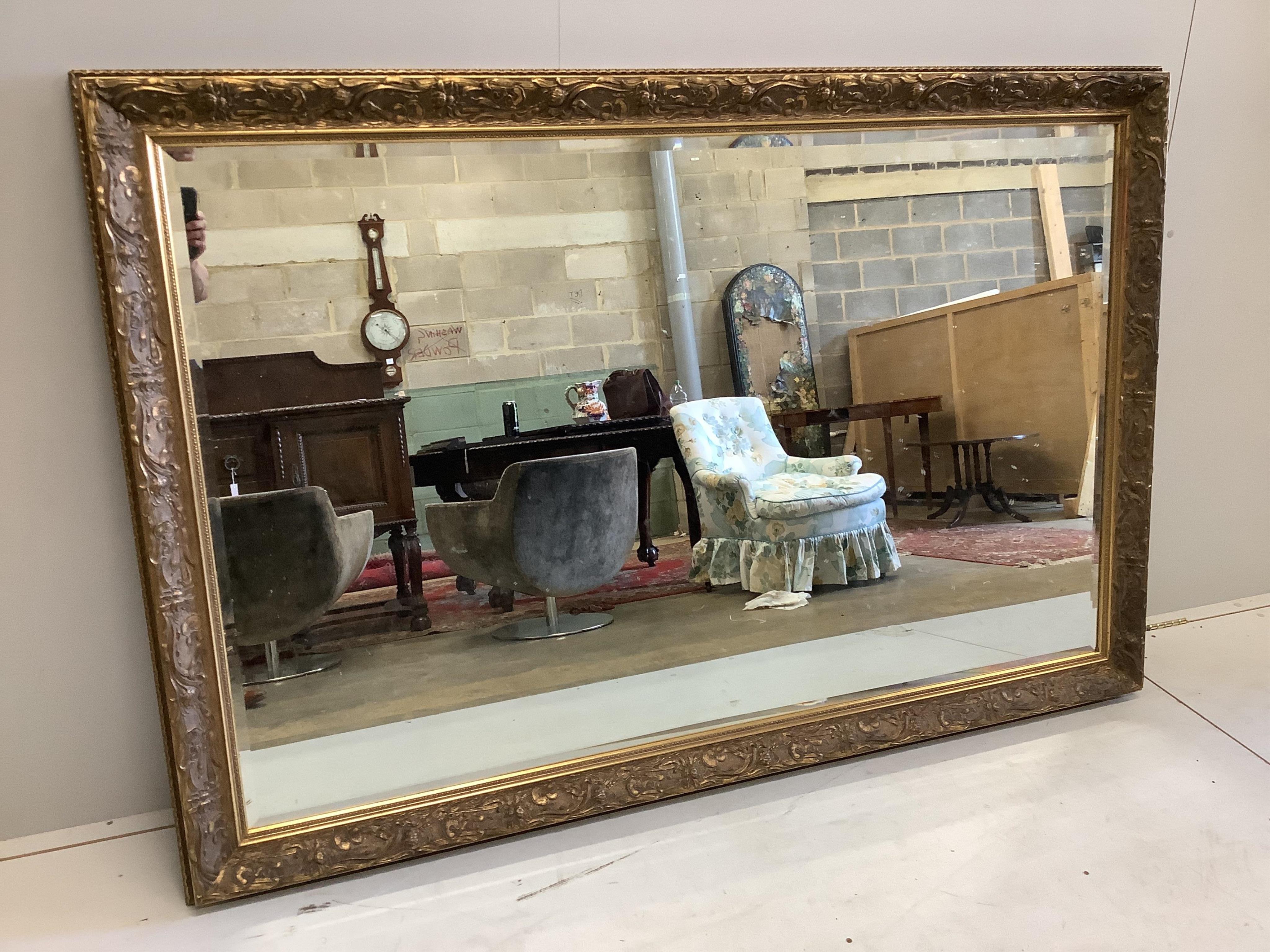 A reproduction Art Nouveau style rectangular wall mirror, width 122cm, height 182cm. Condition - good